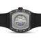 Watch with black strap and visible mechanical components on a white background