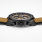 Watch with brown leather strap and black case on a white background
