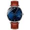 Watch with brown leather strap and blue dial on a white background