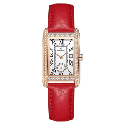 Watch with red strap and rose gold case on white background