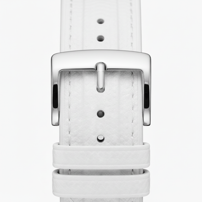 White leather watch strap with silver buckle on a white background