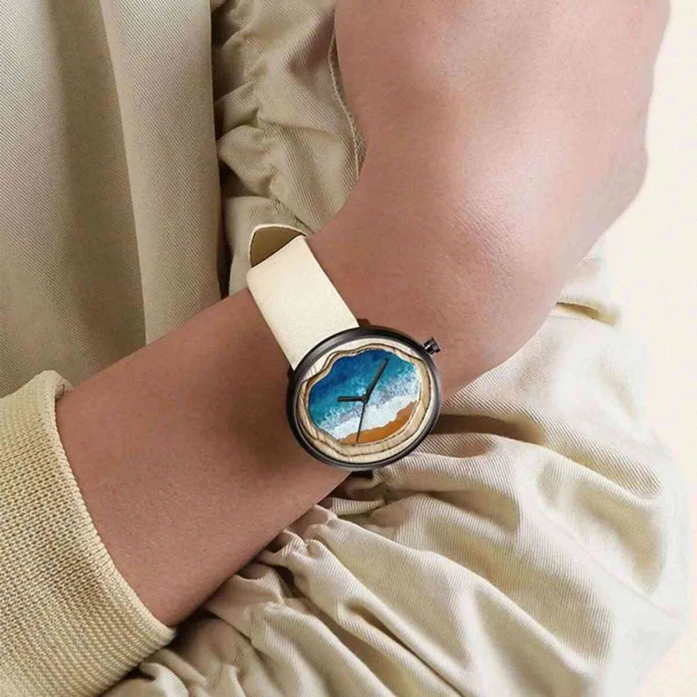 Woman wearing Fairwhale OCELYA 5480 minimalist watch, slim elegant women’s wristwatch with starry dial and leather strap for everyday and evening wear.