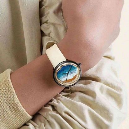 Woman wearing Fairwhale OCELYA 5480 minimalist watch, slim elegant women’s wristwatch with starry dial and leather strap for everyday and evening wear.