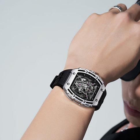 Mark Fairwhale 6700 BARRELIUS barrel-shaped stainless steel automatic watch side view with crown.