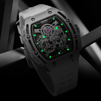 Mark Fairwhale BARRELIUS men’s automatic barrel watch with white rubber strap and luminous skeleton dial.