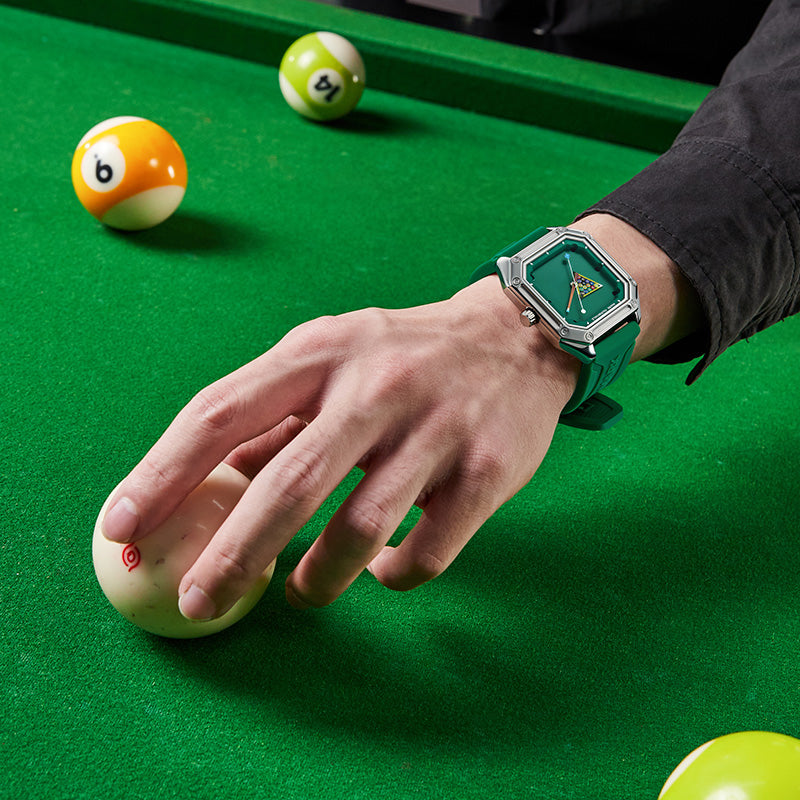 Mark Fairwhale Billiardo FW-5047 green quartz sports watch with billiards dial, square case and silicone strap worn on wrist at pool table