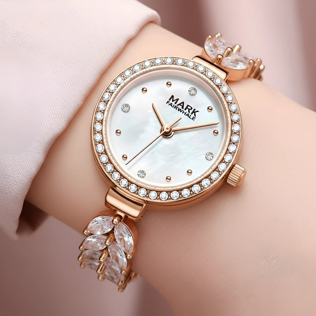 Rose gold watch with diamond accents on a wrist