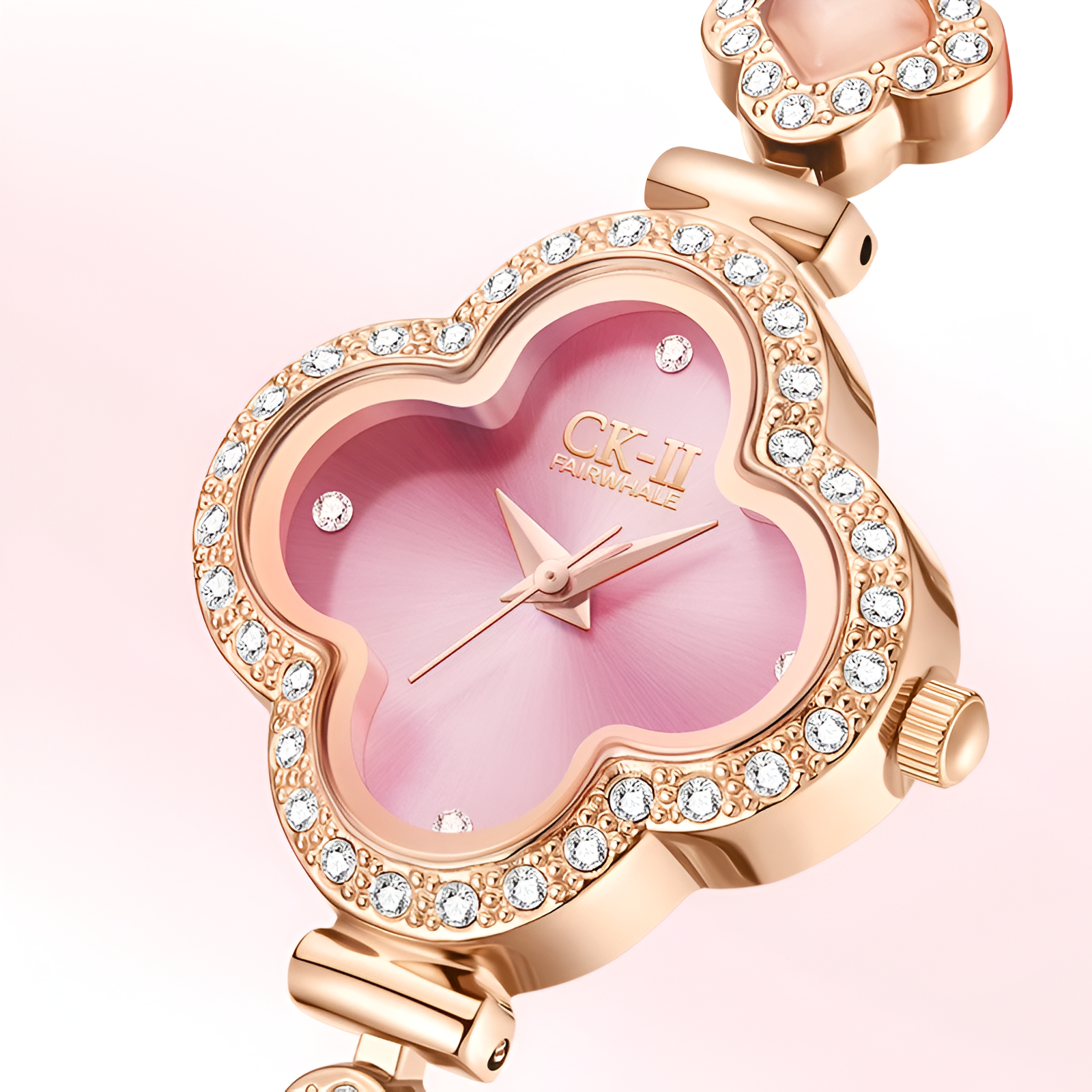 Close-up of Mark Fairwhale FW-3860 LUXORA pink clover dial with crystal-set bezel and rose gold hands