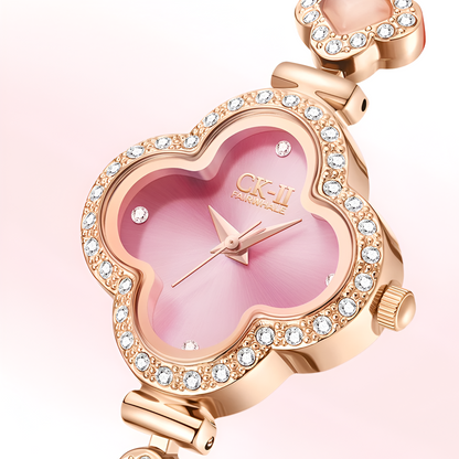 Close-up of Mark Fairwhale FW-3860 LUXORA pink clover dial with crystal-set bezel and rose gold hands