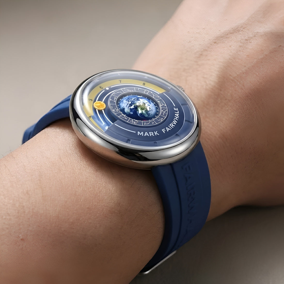 Mark Fairwhale THÉO 5700 globe dial watch on wrist with cosmic blue silicone strap side profile showing curved crystal and polished case