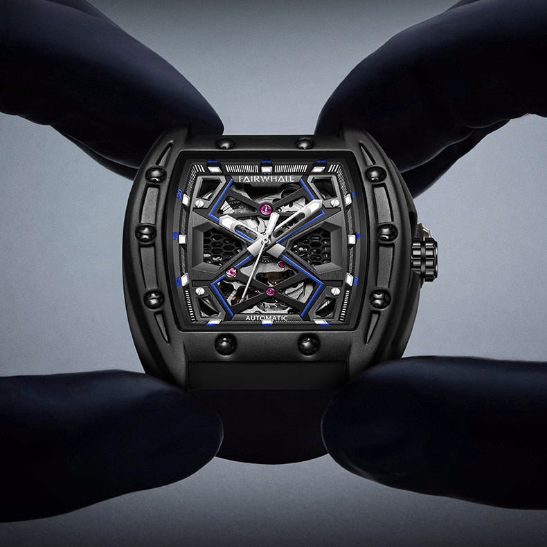 Close-up of Mark Fairwhale Original Hollow Watch held between gloved hands, showcasing skeleton dial and mechanical movement, premium men automatic watch craftsmanship