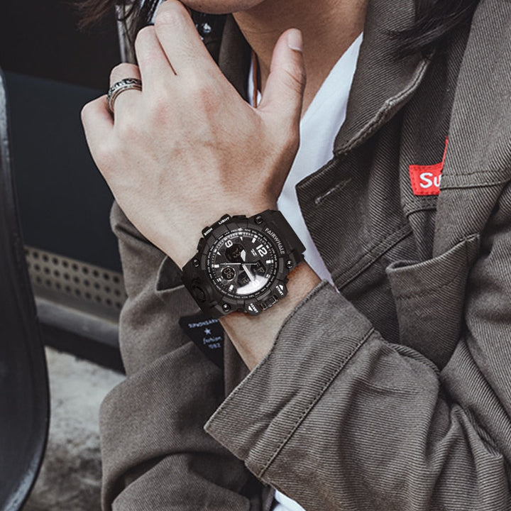 Man wearing the Mark Fairwhale FW-4230 ROGUEFORCE digital-analog watch casually outdoors.